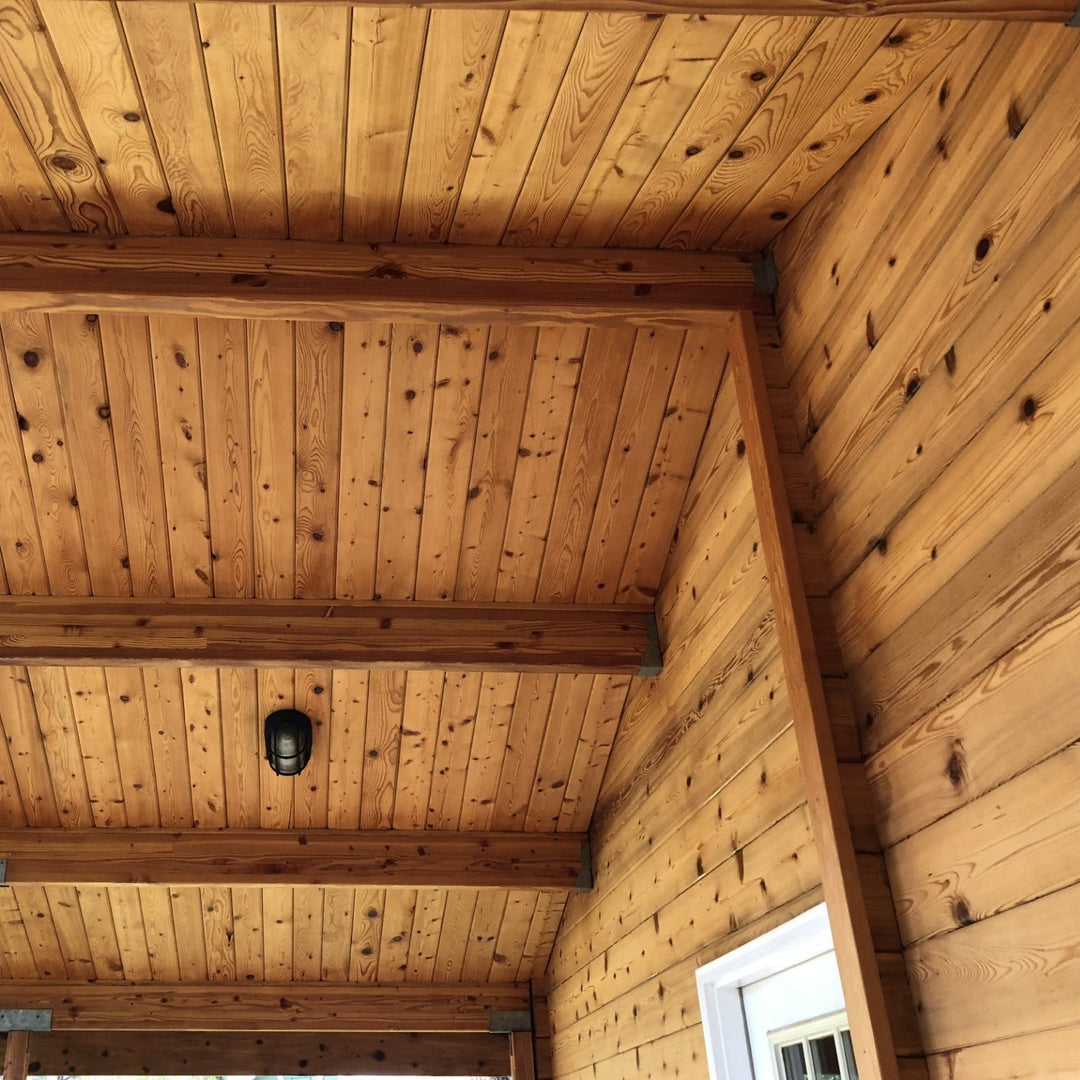 Lovitt's Emerald Gold in Natural tint color on soffits, beams, and logs